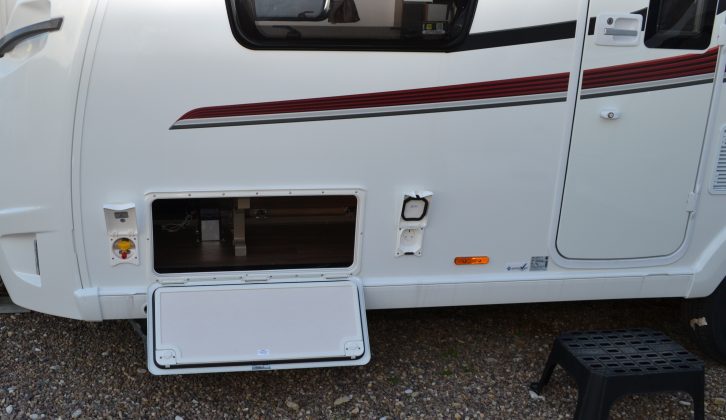 External access to the space under the nearside sofa is flanked by a gas barbecue point and an electric mains socket