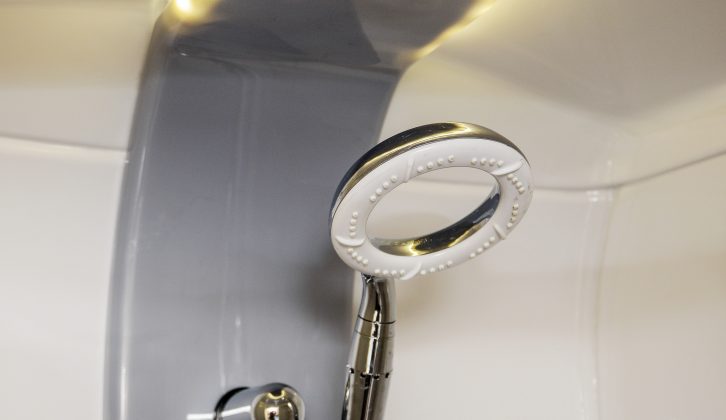 We like the EcoCamel Orbit showerhead (with its own on/off switch) in the Swift Conqueror 560