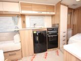 The kitchen boasts a dual-fuel hob, separate oven and grill and a Dometic fridge-freezer