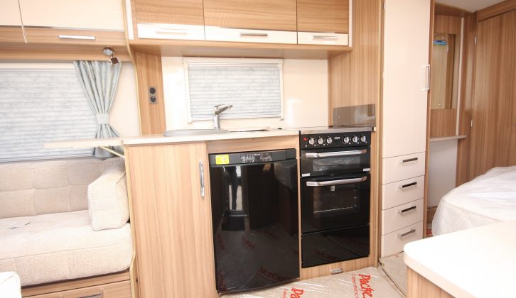 The kitchen boasts a dual-fuel hob, separate oven and grill and a Dometic fridge-freezer