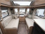 Pale fabrics and lots of windows help the 565's front lounge feel spacious