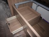 As well as the usual underbed storage, the offside fixed single has a pull-out drawer and a hidden shelf inside, the latter accessed only by lifting the bed base