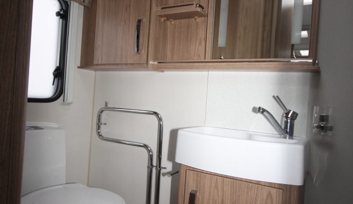 There's an undersink cupboard, and a mirror, shelving and cupboards above in the 565's washroom