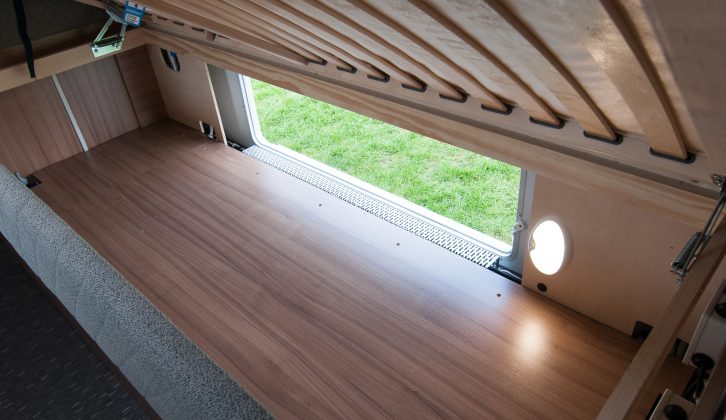 Storage provision is great in the Adria Alpina 613UL Colorado, this space under the nearside bed with a light and external access
