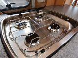 Bailey has placed the controls on the four-burner hob to the side, away from children