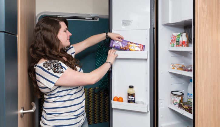 The large fridge features bottle storage in the base