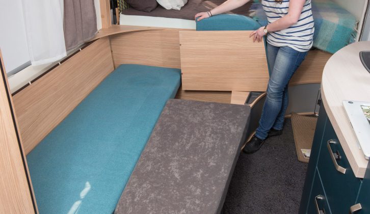 The table drops down and forms part of the lounge bed