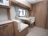 The dinette sits opposite the kitchen, on the caravan's offside