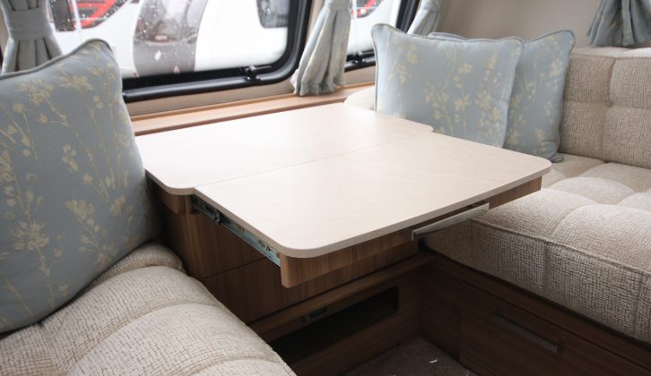 There is a useful occasional table in the lounge of this Lunar caravan