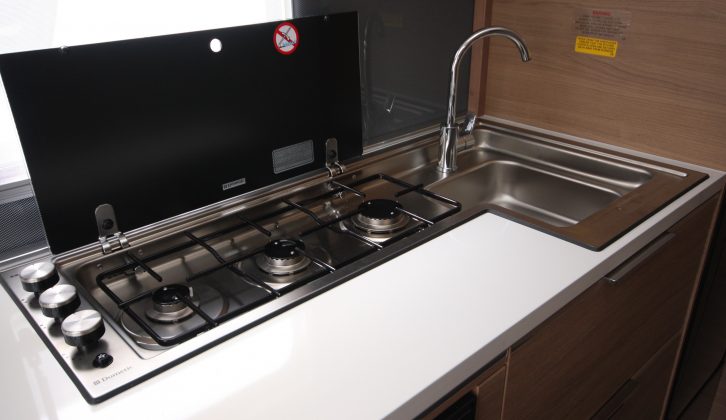 There are three gas burners and a square stainless-steel sink in the Loire's kitchen