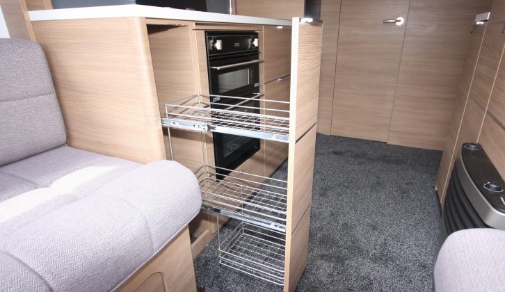 Kitchen storage is boosted by this cupboard with pull-out wire baskets