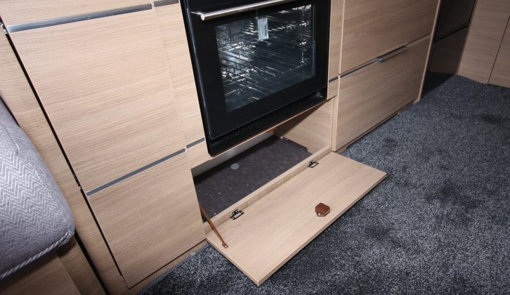 Drop-down flaps below the oven and the drawers lead to more storage cubbies