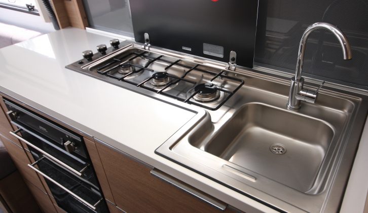 The burners on the hob are set back, in a line, to allow extra worktop in front
