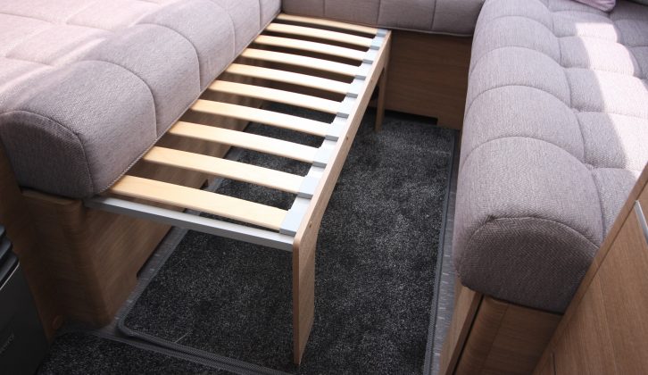 The make-up double bed is 2.12m x 1.54m; or you can use the sofas as short single beds
