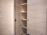 As well as a half-height hanging space over the heater in the wardrobe, you get six shelves