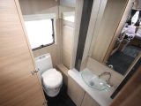 There's a vanity unit, large mirror, loads of cupboards and a Thetford electric flush toilet