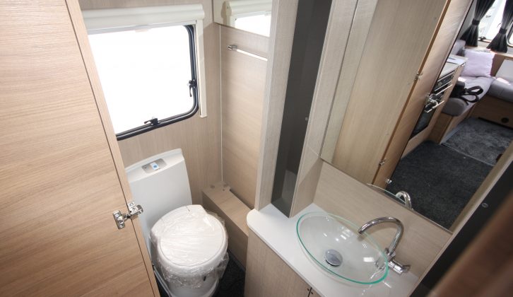 There's a vanity unit, large mirror, loads of cupboards and a Thetford electric flush toilet