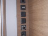 The controls and power points are placed in this neat vertical stack