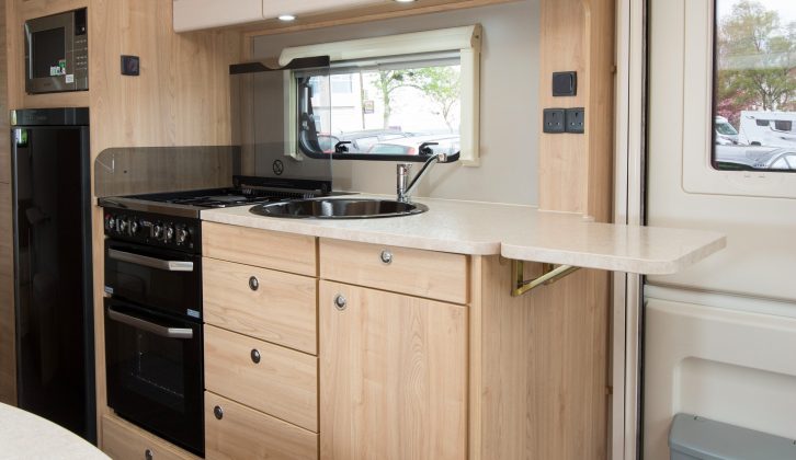 The Elddis Avanté 866 has a well-equipped kitchen with plenty of cupboards, drawers and worktop, plus an extension flap that goes across the entrance door rather than across a sofa