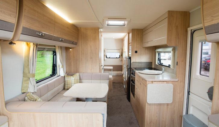 The central U-shaped dinette and kitchen area provide social family space at the heart of this large home-from-home, the van's 8ft width meaning there's lots of room