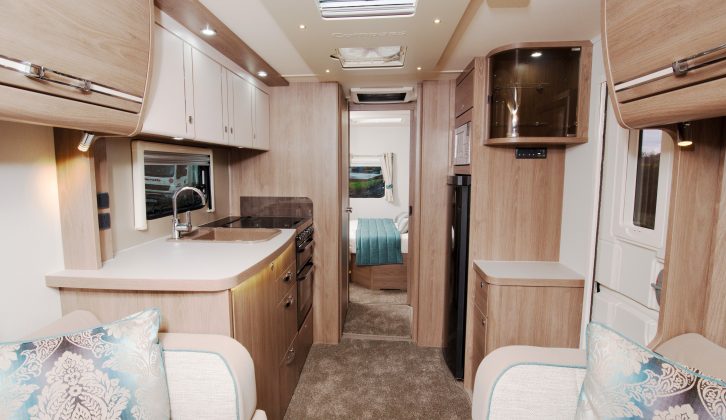 The living area in the Compass Camino 660 feels generous and bright, with the private master suite beyond