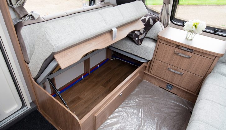 The seat boxes can be accessed via drop-down flaps or like this, by raising the seat cushions