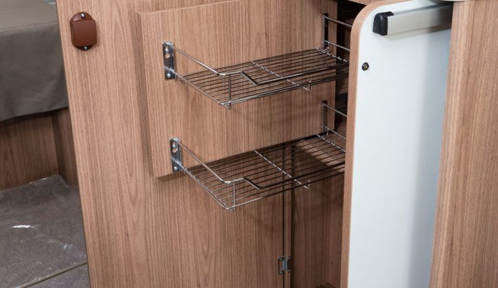 Handy racking plus storage for the freestanding table are well-placed opposite the kitchen