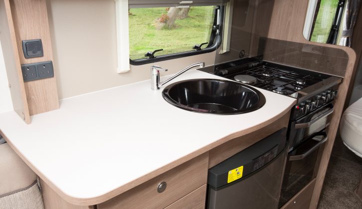 It is a good-sized kitchen which gives caravanners a dual-fuel hob, a fridge, and a separate oven and grill