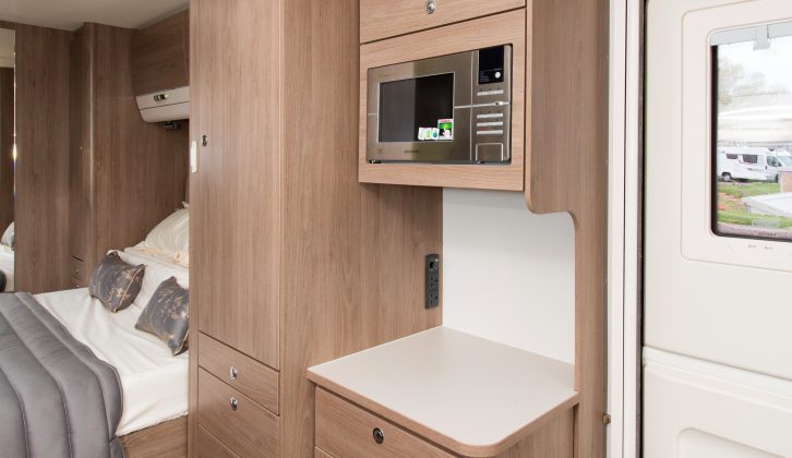 The microwave comes as standard, is at a good height and there's handy worktop below, plus storage space and sockets