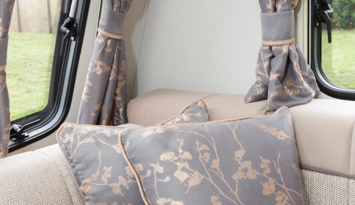 A fetching, subtle grey and gold fabric is used for the cushions and curtains – read more in the Practical Caravan Compass Casita 554 review