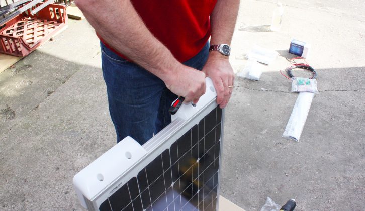 Attach the feet to the solar panel – on the caravan's roof, use tape to mark the panel’s position