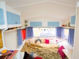 Barbara made the gingham curtains inside this 1979 caravan that was rescued from being a children's wendyhouse