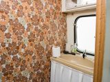 The owners liked the original wallpaper and sink in the washroom so retained them as they were in good condition