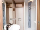 The central washroom’s vanity unit provides a basin, a mixer tap and a narrow worktop
