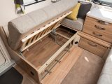 There's a decent amount of under-sofa storage space, and it can be accessed from under the cushions or via a front flap