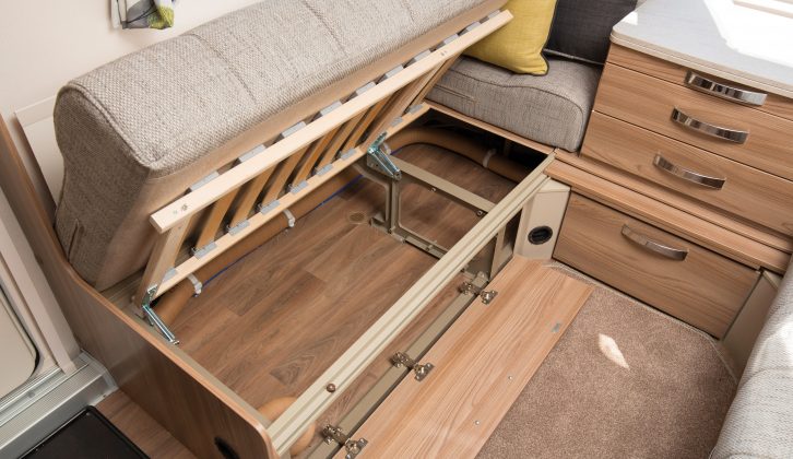 There's a decent amount of under-sofa storage space, and it can be accessed from under the cushions or via a front flap