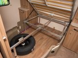 The storage space under the fixed bed will help you use this van's 201kg payload
