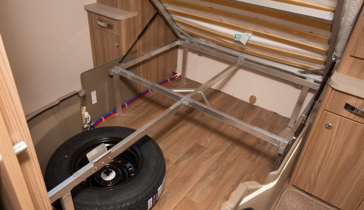 The storage space under the fixed bed will help you use this van's 201kg payload