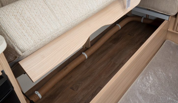 You'll find useful storage space under the sofas, but no drop-down flaps