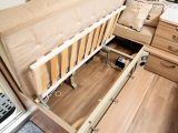 The storage cavities under the sofas can be accessed from under the seat cushions or via drop-down access flaps