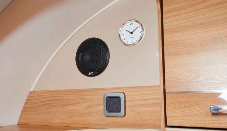 You’ll find a smart gold clock located up front in this Bailey caravan, beside one of the speakers