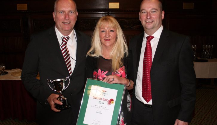 Martin Kinney and Ann Whelan celebrate their win with Regional Manager David Gray