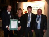 Owners Sharon and Dean Philpin,  accept their award from the Right Honourable Sir Nicholas Soames, MP, and Grenville Chamberlain, Chairman of The Caravan Club