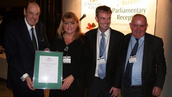 Owners Sharon and Dean Philpin,  accept their award from the Right Honourable Sir Nicholas Soames, MP, and Grenville Chamberlain, Chairman of The Caravan Club