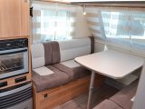 Seating extends beyond the table, allowing space for putting your feet up, however a combi oven and grill gives UK-market appeal but its position below the wardrobe is awkward