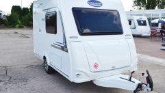 The Caravelair Antarès 335's budget status is evident with these simple decals, but it does have external locker access