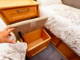 A small stool slides neatly under the rear central chest of drawers when not in use, and can be used for storage