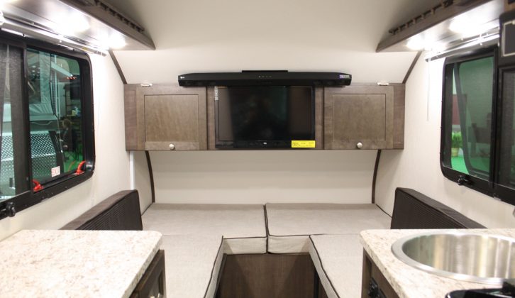 The A-Liner Ascape's lounge makes up into an enormous double bed. This example has the A-Plus pack, bringing a TV, air-con and Bluetooth sound bar