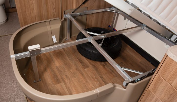 Lift the fixed bed to reveal a useful storage space – read more in the Practical Caravan Swift Challenger 645 review