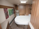 In day mode, the island double bed leaves plenty of space to access the end washroom